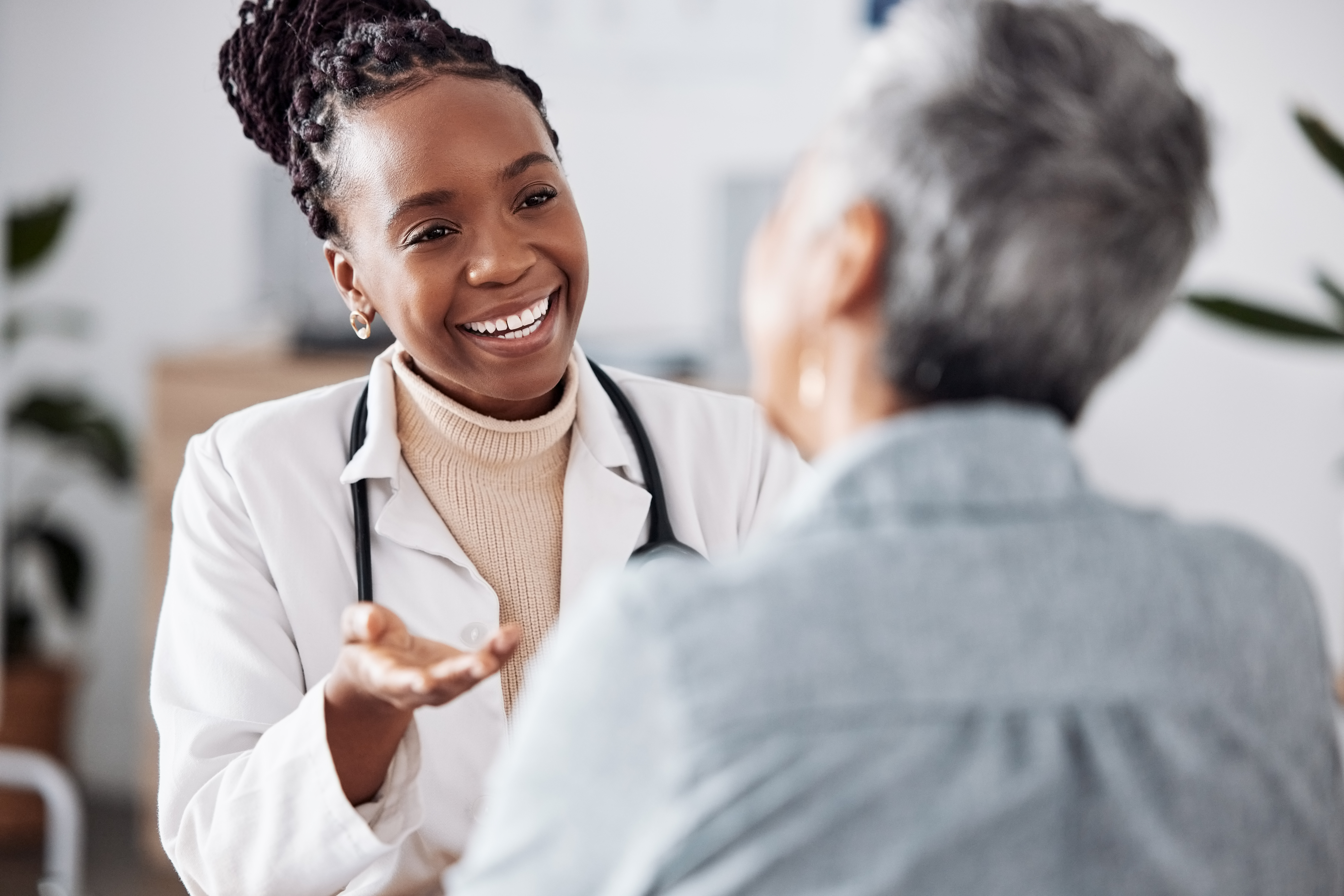 Nurse assisting a patient in a hospital setting, representing DNV DIAS accreditation focused on patient safety and quality care