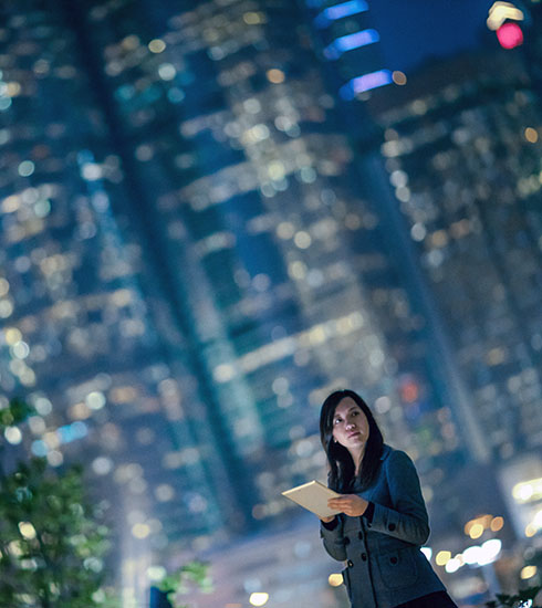 Cloud - woman using tablet in city